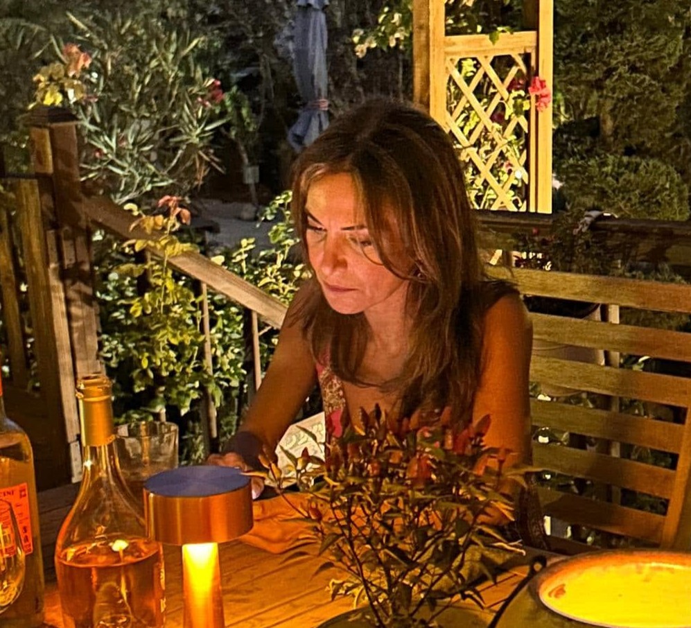 Elsa Lebbos at an evening table
